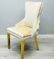 Chaise de salle à manger moderne capitonnée haut de gamme avec anneau de traction tête de lion, revêtement en velours gris, structure en acier inoxydable