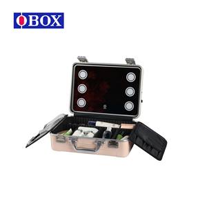 Estuche de maquillaje profesional Obox con luz, caja de cosméticos portátil de gran capacidad en metal rosa claro para artistas y técnicos. - Product Image 1