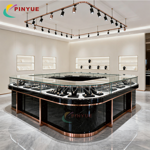 เคาน์เตอร์โลหะกระจกหรูหราทันสมัย เคาน์เตอร์<span class=keywords><strong>ร้าน</strong></span>ค้าปลีกแบบกำหนดเอง ออกแบบตกแต่งภายในร้านขายเครื่องประดับ ตู้โชว์เครื่องประดับทรงกลมกระจก - Product Image 4