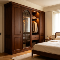 Armoire de chambre intégrée sur mesure en MDF avec revêtement PVC, panneau surélevé, porte vitrée cintrée, grille à meneaux, LED, finition noyer moderne, OEM