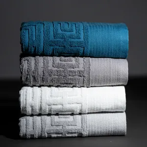 Di lusso di alta qualità in cotone 100% per la casa set di asciugamani in rilievo bianco jacquard asciugamano per il viso logo personalizzato