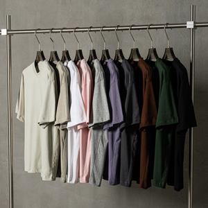 Camiseta en blanco de color sólido OEM Camiseta de gran tamaño lisa con logotipo personalizado unisex de alta calidad - Product Image 1