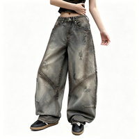 Pantalon en jean délavé effet dégradé avec patchwork à lames courbes, coupe droite ample, style streetwear, taille haute, jambe large
