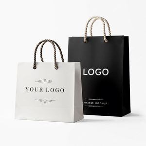 ถุงกระดาษของขวัญสำหรับร้านค้าปลีกหรูหราสีดำแบบกำหนดเอง พิมพ์โลโก้พร้อมหูหิ้ว สำหรับร้านบูติก - Product Image 1