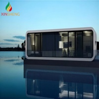 Maisonnette préfabriquée moderne de type Apple Cabin, démontable, pour bureau, habitation ou conteneur.