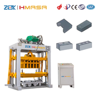 Machine automatique de fabrication de blocs de béton QTJ4-40 avec système de moules modulaires pour briques autobloquantes