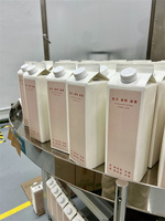 Machine d'emballage automatique pour lait, jus, yaourt, eau, boissons et aliments, machine de remplissage et de scellage de cartons à toit plié, matériau papier