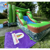 Château gonflable personnalisé sur le thème des dinosaures avec toboggan aquatique pour la location