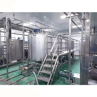 Machine de remplissage et de capsulage par soufflage rotatif personnalisé entièrement automatique 10000BPH bouteille PET lait pasteurisé ligne de production
