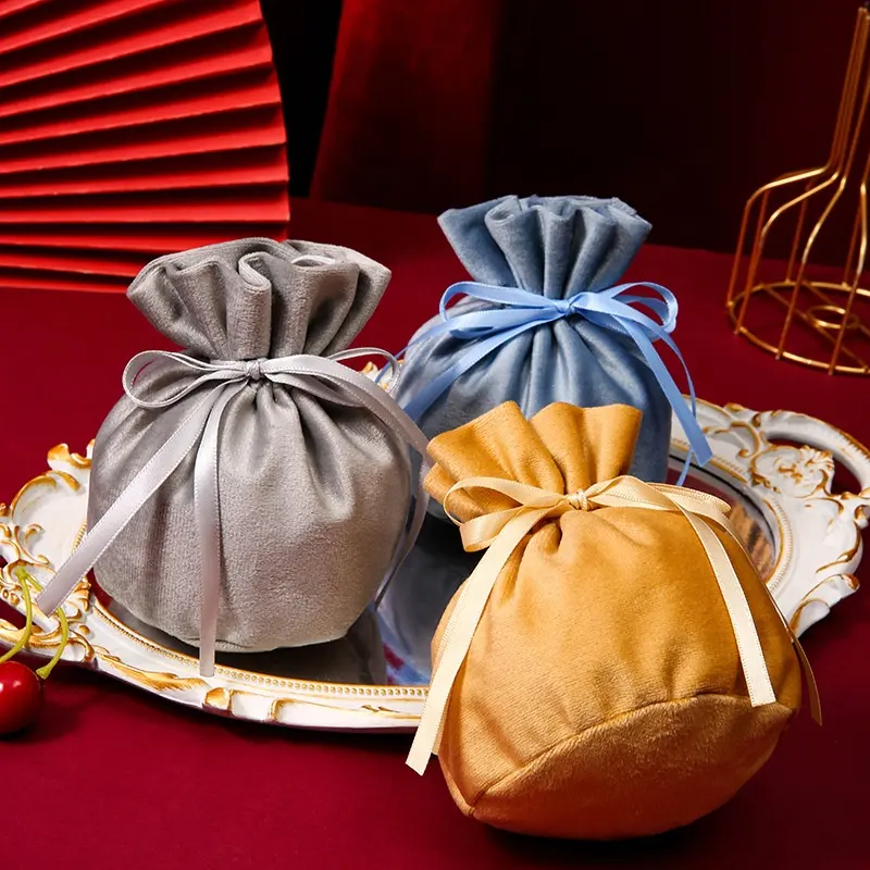 Sacchetto di imballaggio di gioielli in tessuto di velluto con coulisse europeo personalizzato sacchetto di caramelle per Souvenir di nozze con Logo Bowknot