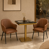 Ensemble table et fauteuils, surface en pierre frittée noire avec base en piédestal doré, mobilier pour café, terrasse et véranda