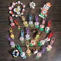 Porte-clés en plastique étanche avec pendentif en résine PVC, motifs de fleurs variées (tulipe, tournesol), style dessin animé mignon, pour sac et écouteurs