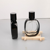 Botella de Perfume de Vidrio Ovalada de 30 ml con Borde Negro y Tapas Negras, Personalizable con la Etiqueta de su Marca