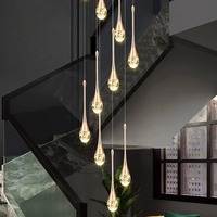 Lustre en cristal à hauteur réglable avec finition dorée LED à intensité variable pour salon