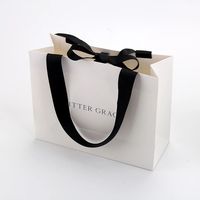Sacs en papier personnalisés imprimés, sacs cadeaux en carton blanc kraft de luxe avec poignée en ruban pour sac de shopping avec votre propre logo