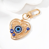 Porte-clés ethnique turc en métal émaillé, forme cœur rond, avec œil bleu porte-bonheur contre le mauvais œil