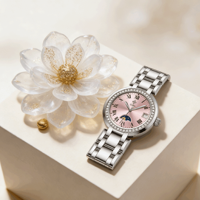 Montre pour femme Guihua à porter au quotidien, cadran analogique rose, lunette sertie de diamants, affichage de la date, bracelet en acier inoxydable, montre-bracelet décontractée pour le travail