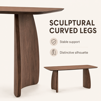 Table à manger de style européen moderne en bois d'acajou avec plateau en oxyde de magnésium à bords arrondis et pieds incurvés