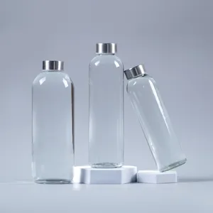 Bouteille de boisson en verre transparente personnalisable rechargeable de 1000ml pour usage hôtelier avec bouchon à torsion