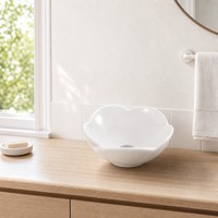 Lavabo rond design moderne en porcelaine artistique pour salle de bain d'hôtel