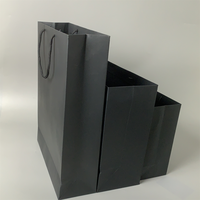 Vente en gros de sacs d'emballage en papier de luxe noirs chaussures vêtements imprimé logo personnalisé vêtement shopping cadeau bijoux emballage sac en papier