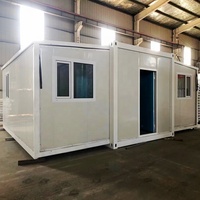 Maison conteneur préfabriquée extensible de luxe avec 2 chambres aux normes australiennes avec panneau sandwich pliable en acier pour cuisine