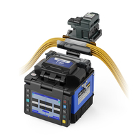 Máquina de Empalme de Fibra Óptica FTTX Orientek T49, Empalmadora Portátil con Cortadora de Fibra, Electrodo con Vida Útil de 5000 Usos