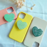 Vente chaude support universel de poignée de doigt de téléphone nouveaux accessoires en forme de coeur de puissance de paillettes en matériau PC Durable