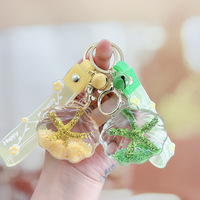 Porte-clés en acrylique en forme d'étoile de mer avec bouteille flottante pour sable mouvant, idéal pour voiture, sac à dos d'étudiant, petit cadeau, ornement suspendu