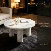 Table basse de luxe en marbre blanc. Table basse élégante en pierre naturelle ronde avec pieds cylindriques pour la décoration moderne du salon.