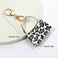 Porte-clés Pendentif Sac Courbé Minimaliste Moderne à Imprimé Léopard en Cuir PU, Porte-monnaie, Décoration de Sac de Voiture Transfrontalier