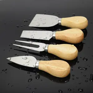 Amazon Venta caliente 4 piezas de madera de la manija de acero inoxidable queso cuchillo cortador de queso conjunto
