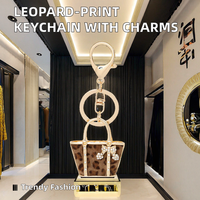 Nouveau porte-clés créatif en forme de petit sac léopard, pendentif de voiture exquis, cadeau pour femme