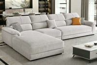 Canapé d'angle Chesterfield en cuir capitonné de luxe léger, style américain et français, avec cadre en bois massif sculpté doré pour salon