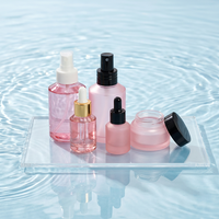 Ventes en gros de pots en verre cosmétiques de luxe et de flacons de lotion pressés avec finition personnalisée pour l'emballage de crèmes et d'essences pour soins de la peau