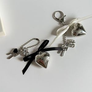 Estilo coreano diseño de nicho marco de fotos llavero de Metal plata amor arco bolsa colgante estilo Ins - Product Image 5