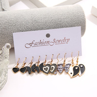 Vente en gros de boucles d'oreilles créatives avec pendentifs en forme de papillon noir, ensemble de boucles d'oreilles Tai Chi en forme de cœur, accessoires pour femmes