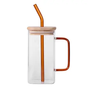 Gelas kaca persegi bening penjualan laris dengan pegangan sedotan dan tutup untuk gelas minum pesta air atau teh kopi es