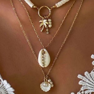 Collier tendance en acier inoxydable pour femme, pendentif coquillage et conque à franges, style marin estival, avec étoile de mer, collier multicouche - Product Image 1