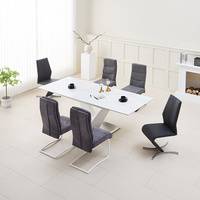 Table à manger élégante en pierre frittée extensible, gris marbre, avec pieds métalliques réglables pour salle à manger d'hôtel moderne