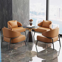 Ensemble de meubles de luxe moderne, fauteuil lounge en cuir PU orange, table ronde en pierre frittée, mobilier commercial pour hôtel