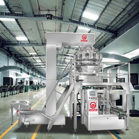 Machine d'emballage pour sachets préformés en papier kraft à fond plat, type doypack, pour biscuits miniatures aux pépites de chocolat, snacks, etc.