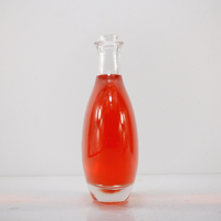 Bouteille en verre ronde très populaire de 500ml avec différentes capacités et différents poids et différents bouchons pour différents emballages