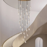 Lustre moderne de luxe en laiton doré, suspension décorative LED en verre en forme de goutte de pluie pour entrée à plafond haut