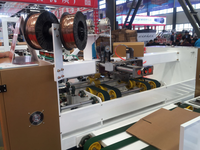 Nueva Máquina Automática para Coser y Flejar Cajas de Cartón