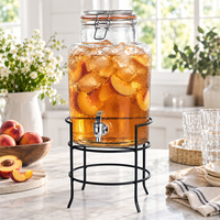 Distributeur d'eau et de jus en verre de 1 gallon avec robinet en acier inoxydable, support métallique et couvercle à clip pour service de boissons extérieur et traiteur