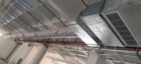 Système de dispersion et de ventilation d'air textile utilisant des conduits d'air en tissu industriels pour les ateliers et les usines