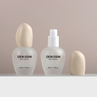 Vente en gros d'usine, flacon en verre givré ovale de 30 ml, emballage élégant pour sérum de soin de la peau ou crème pour le visage