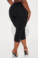 Pantalon Capri pour femme à taille élastique et taille haute, avec détail nœud, couleur unie, coupe évasée, ourlet fendu, coupe ample et respirant