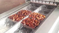 Machine d'emballage sous vide pour dattes 500g 1000g, machine de thermoformage pour l'emballage des dattes